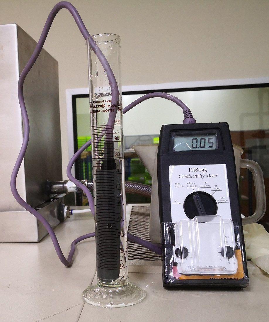 Conductivity meter measuring a water sample